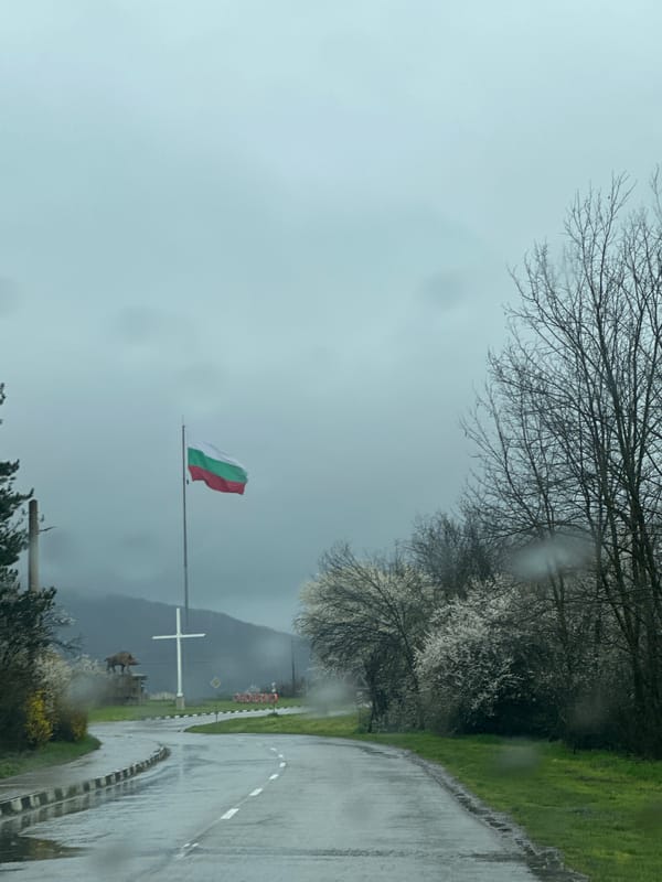 Rainy day scene with Bulgarian flag on Smyadovo road