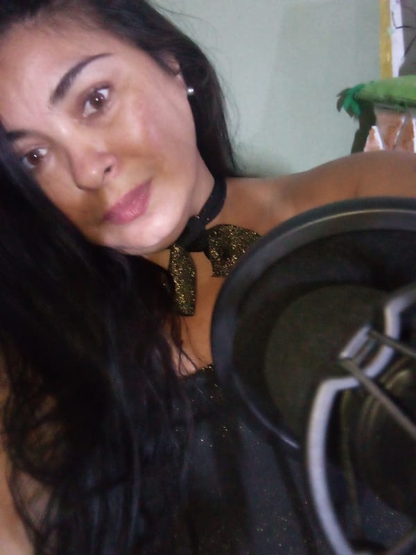 Woman records vocals in home studio in Juan Griego