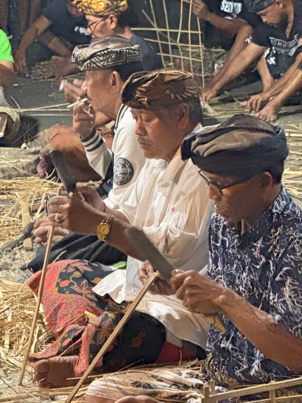 Ubud community gathers at night for ceremonial preparations