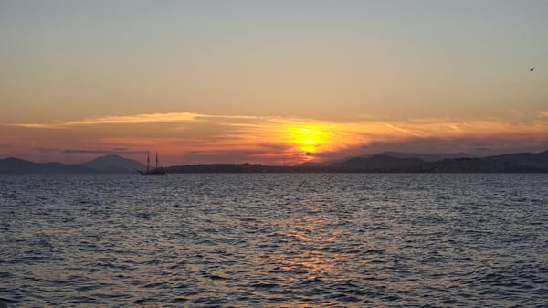 Sunset observed over water in Alimos, Greece