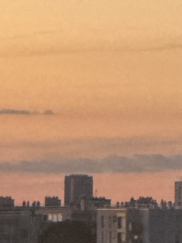 Dusk cityscape views paired with close-up nail art shots