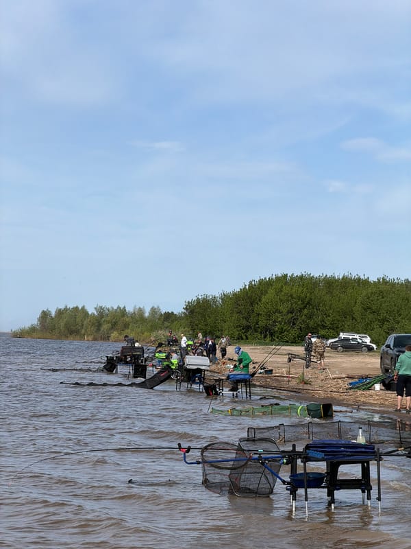 Early morning fishing group gathers at Krasnyi Bor lakeside