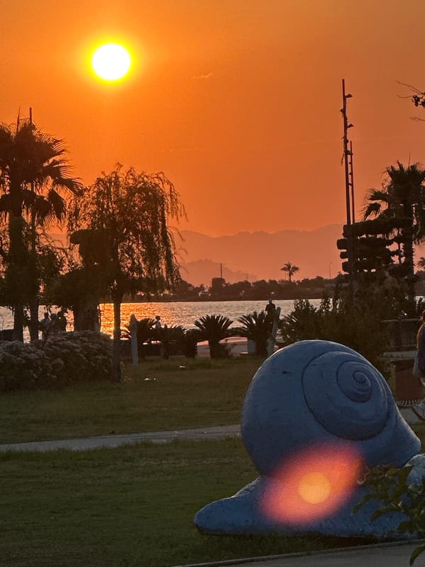 Fethiye waterfront park at sunset: exercise, sculpture, golden skies