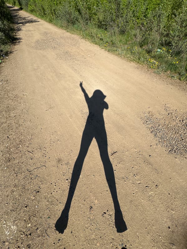 Shadow cast on rural path in Chaikovsky, Russia