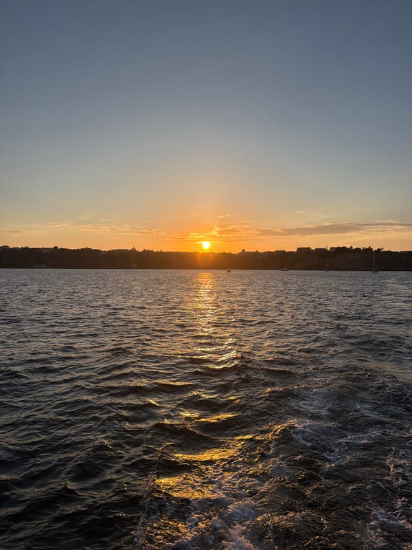 Sunset and coastal views captured from sea near Procida