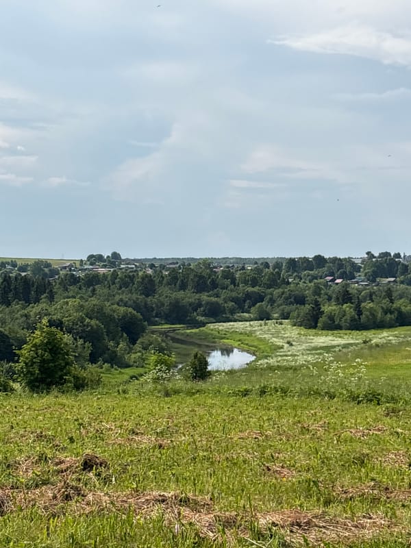 Rural summer morning across two small Russian settlements