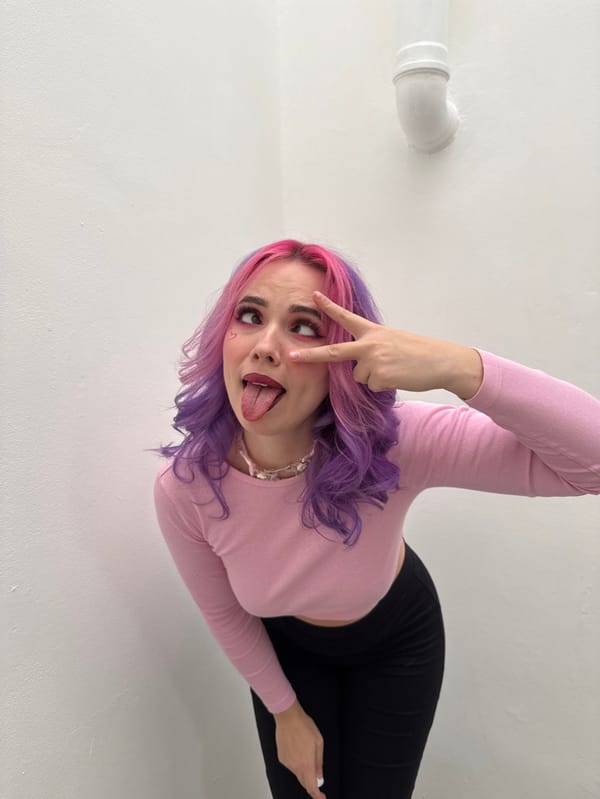 Pink-purple haired woman poses throughout Zagreb on Valentine's Day