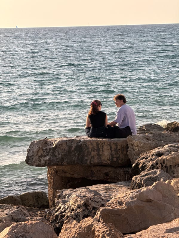 Tel Aviv residents enjoy Mediterranean coastline during summer afternoon