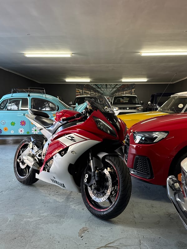 Red and white Yamaha R6 parked indoors, Cape Town garage