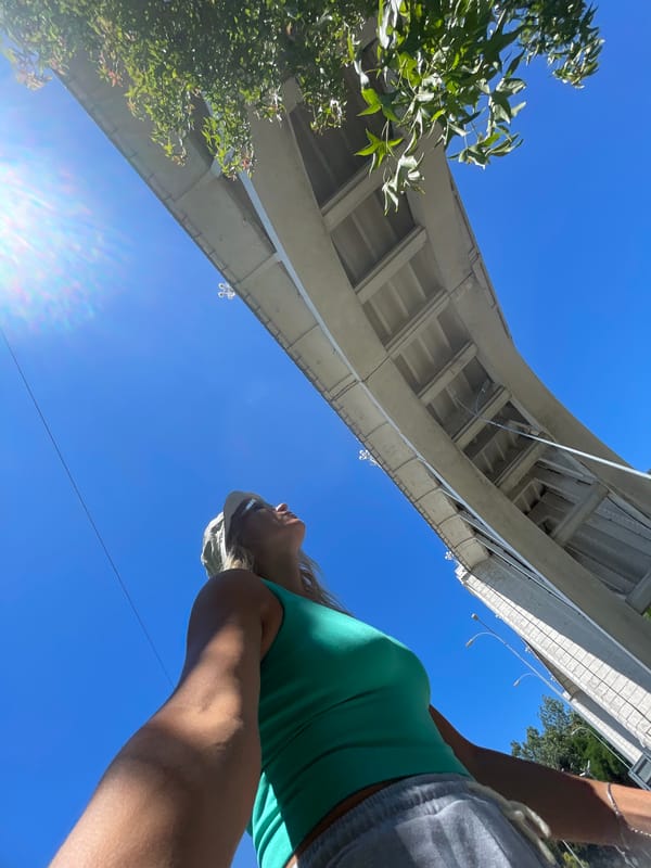 Looking up at a concrete bridge on a clear day in Sochi