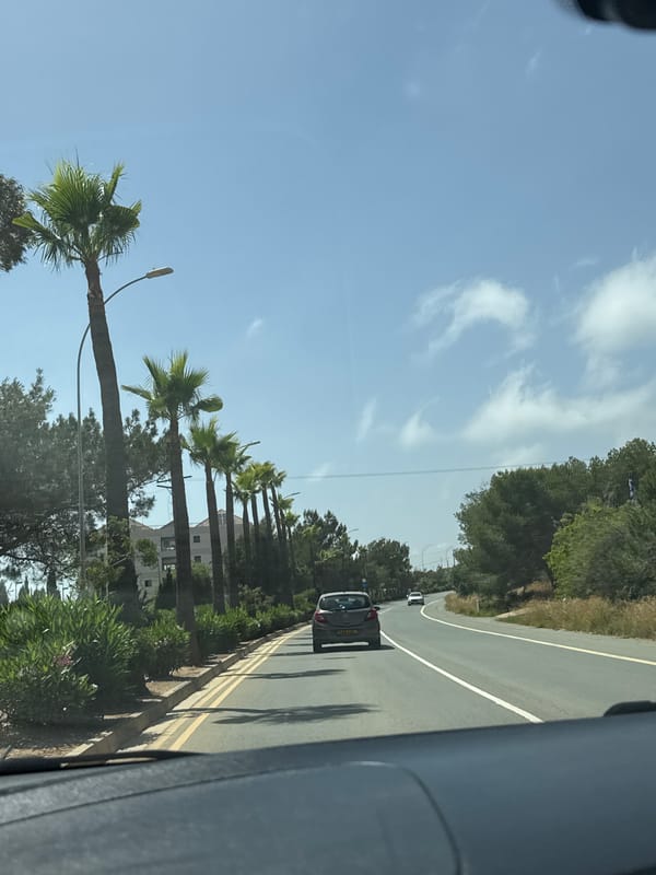 Vehicle travels coastal road in Ayia Napa, Cyprus