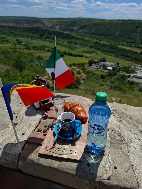 Outdoor breakfast in Trebujeni with Italian and Moldovan flags