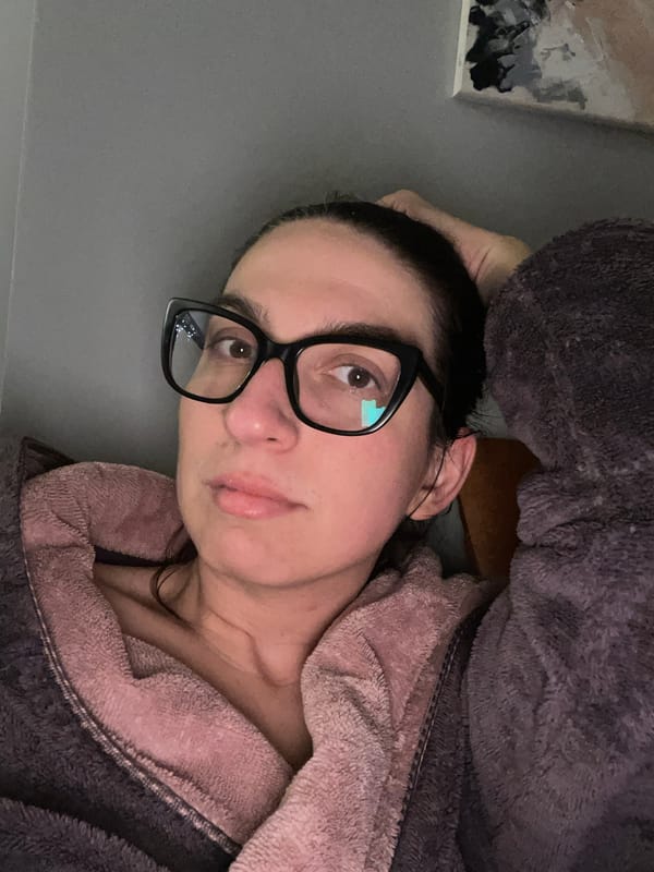 Woman relaxes in bathrobe, Sofia evening scene captured