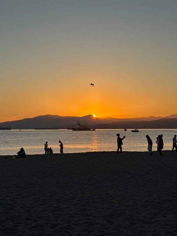 Sunset crowd gathers at Kitsilano Beach, Vancouver