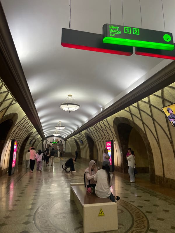 Almaty streets, metro stations, and a late-afternoon soccer game