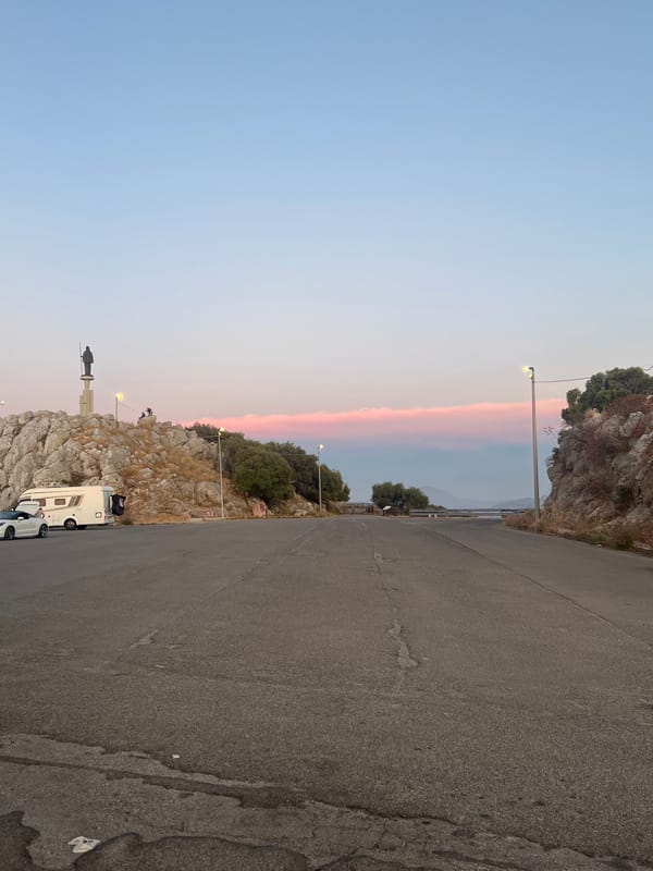 Sunset gathering documented at Palermo coastal overlook with food drinks