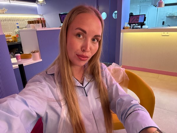 Woman takes selfie amid crafting scene in Sochi cafe