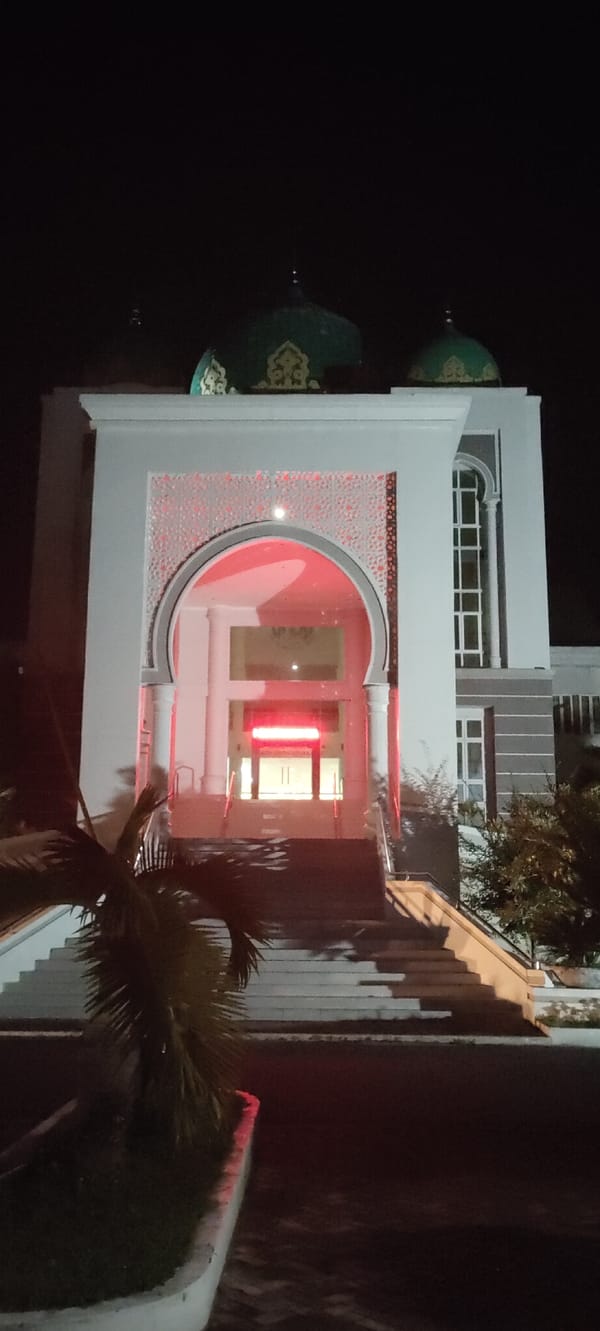 Nighttime scenes documented around Lhokseumawe mosque and streets