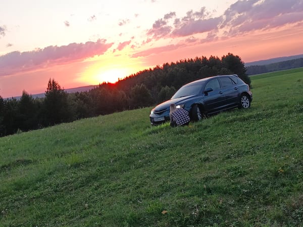 Car break during sunset viewing in rural Russia