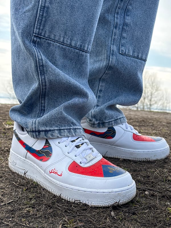 Person in custom sneakers photographed in rural Russia