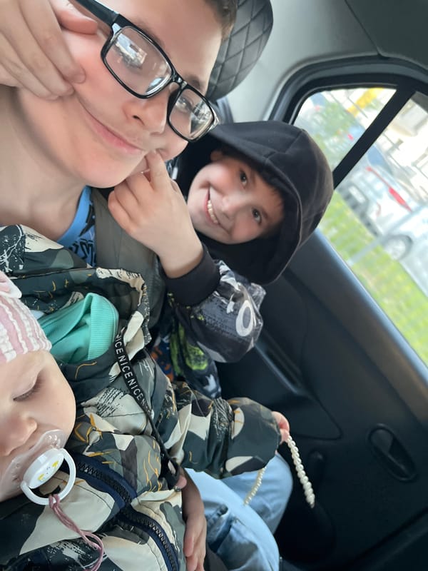 Family group travels together in car in Sirius, Russia
