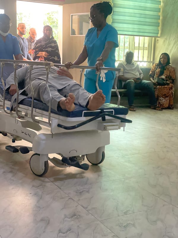 Inside a hospital in Abuja during an active patient care moment.