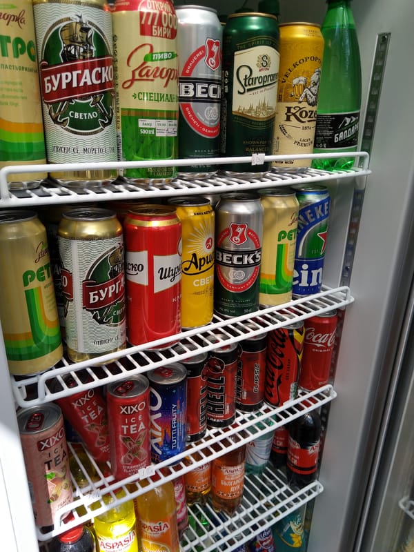 Convenience store fridge stocked with canned drinks in Kyustendil