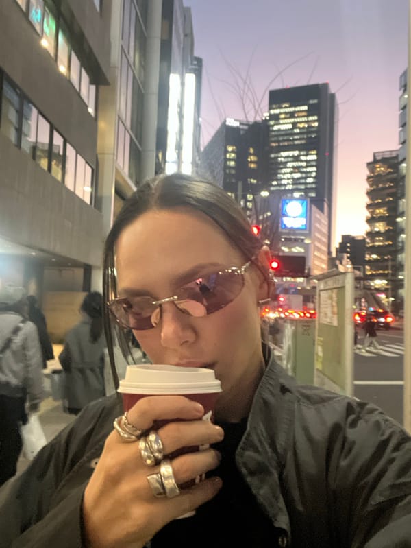 Woman in tinted sunglasses photographed on Shibuya street