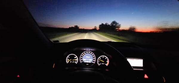 Driver travels Bulgarian road at twilight near Byala Slatina