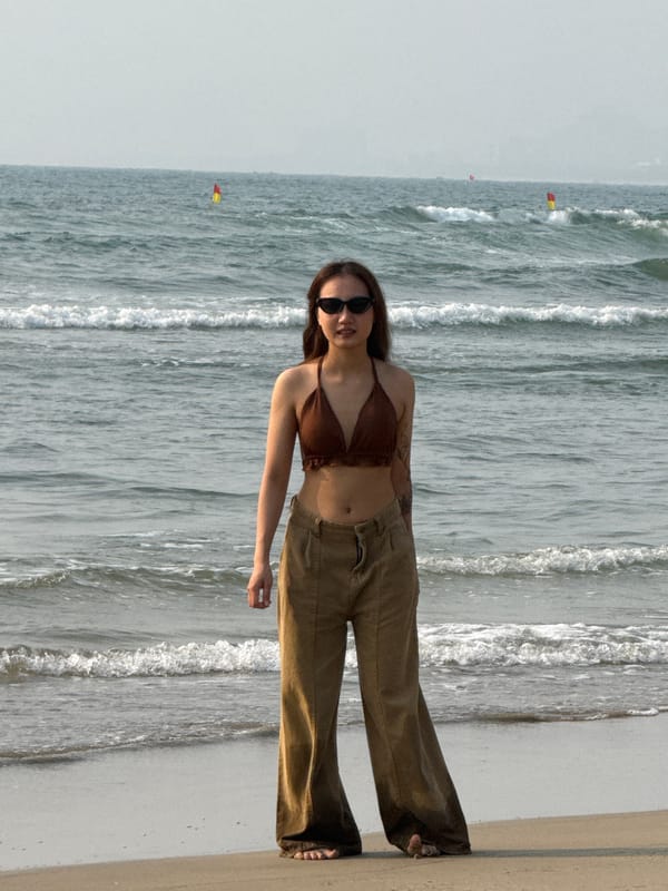 Woman enjoys late night beach scene in Đà Nẵng