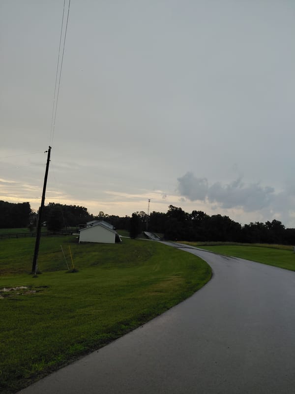 Rural roads and a pond on a quiet overcast day in Bagdad