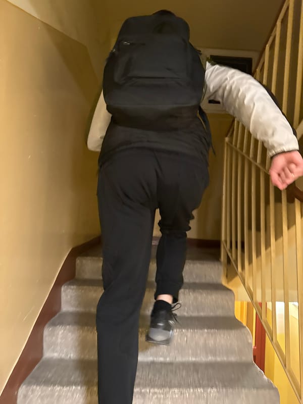 Woman takes selfies, moves through Łódź residential area