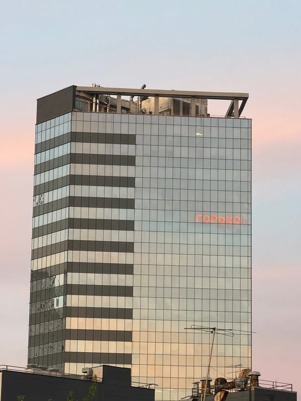 Mirrored building displays vertical text in Samara, Russia