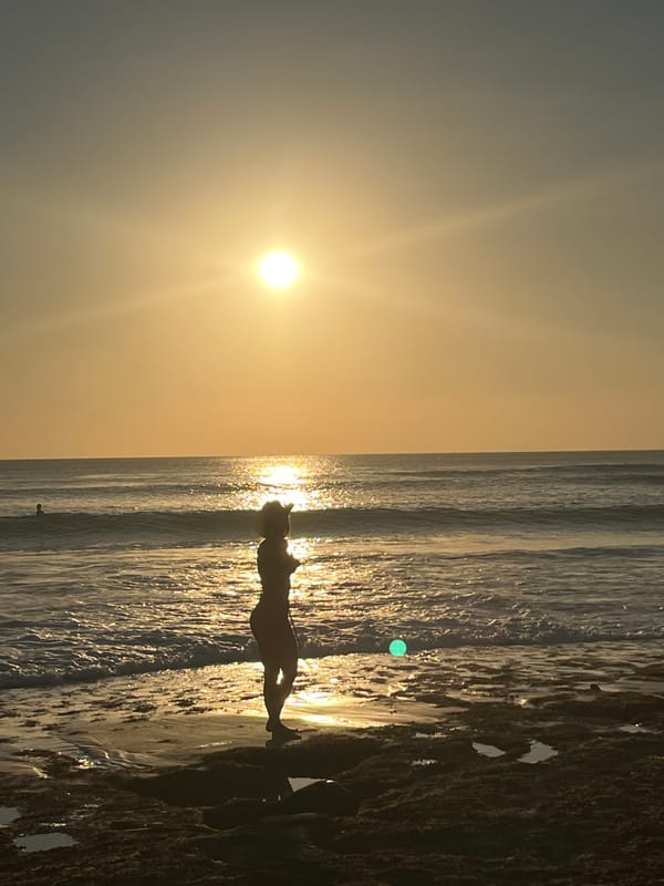 Sunset beach activities and volleyball games on Kuta Beach