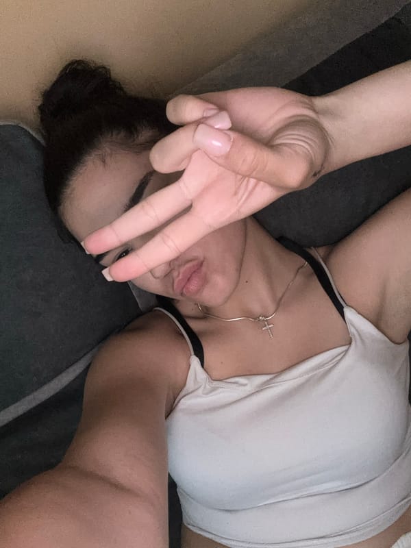 Woman takes selfies on couch in Gabrovo apartment