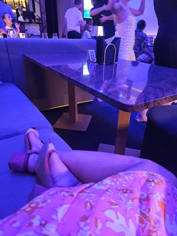 Karaoke Night Documented at Blue-Lit Lounge Venue