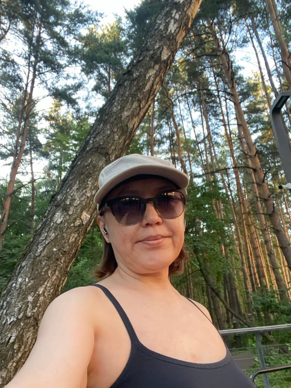 Evening stroll through a park with wildflowers and birch trees