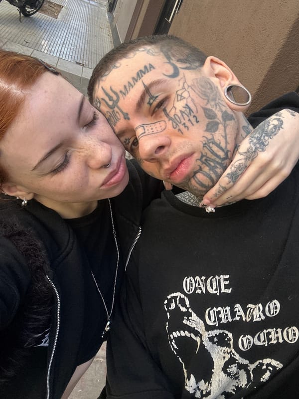Couple embraces in Buenos Aires street scene