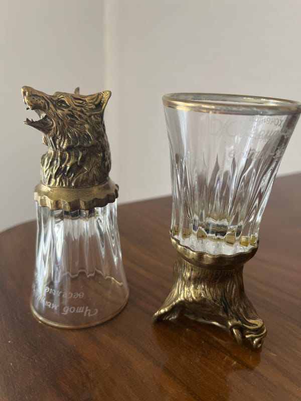 Tabletop display of ceramic animal figurines and houseplants