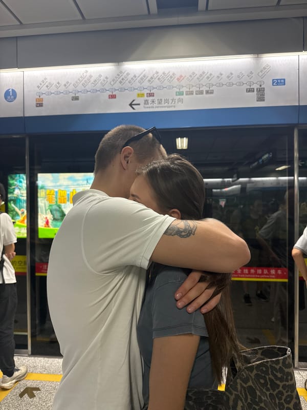 Goodbye moment on a Guangzhou subway platform