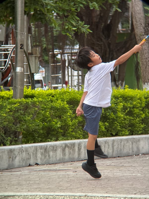 Badminton in a Nha Trang park, mid-game moments