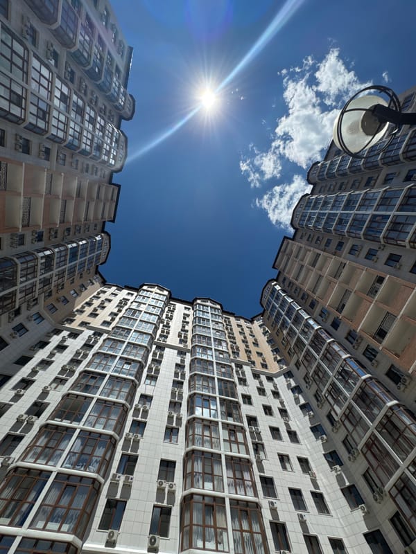 Sunny morning at a residential complex, from towers to garden details