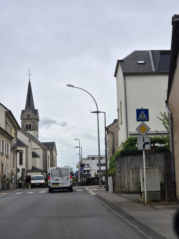 Overcast street scene documented in Leudelange, Luxembourg