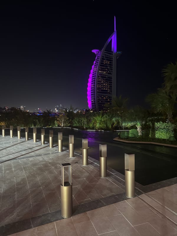 Burj Al Arab hotel glows purple in Dubai night illumination