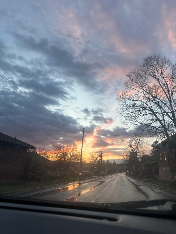 Motorist captures dramatic sunset through rain in Bulgarian village