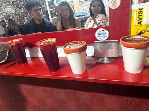 Three women take group selfie in San Andrés Cholula establishment