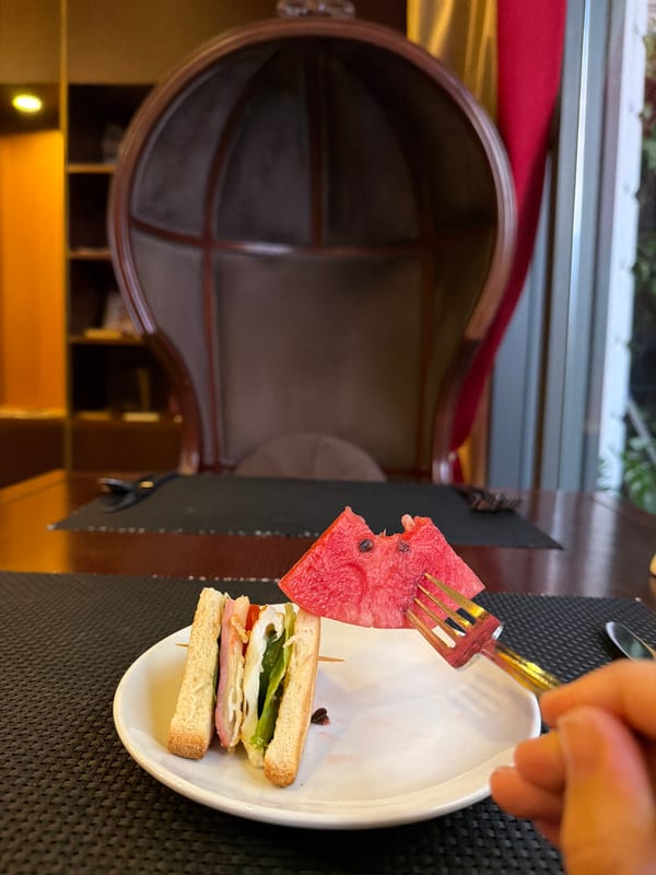 Fruit, food, and street details at a Huế restaurant