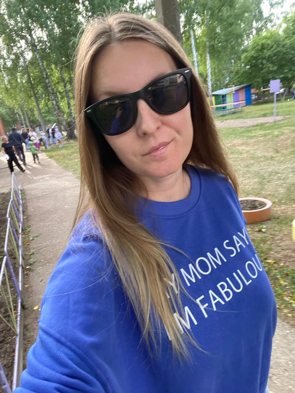 Woman in novelty sweatshirt photographed around Noviy, Russia
