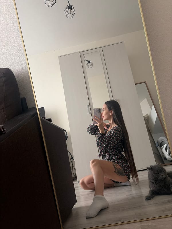 Woman takes mirror selfies indoors in Saint Petersburg