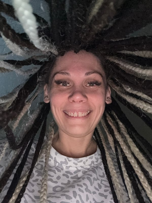 Person resting and smiling captured in Rusanovo, Russia